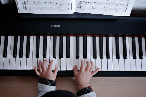 Kid having a piano lesson